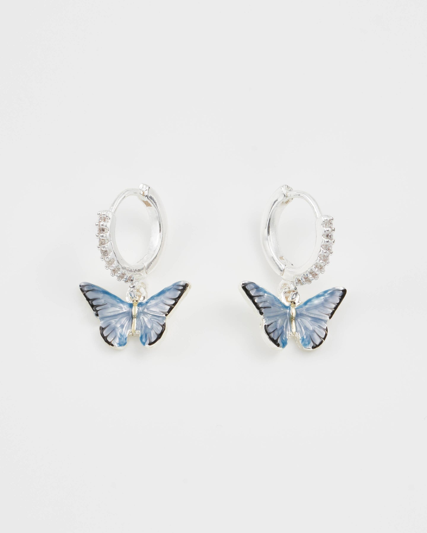 Blue Butterfly Silver Huggie Earrings by Fable England