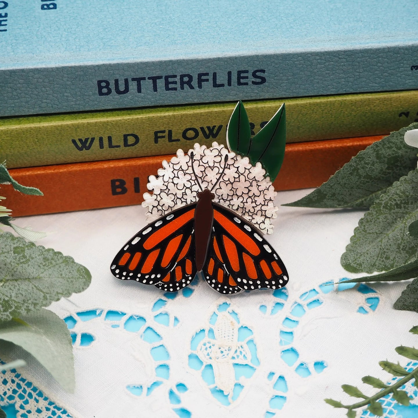 Dolly Dimple Design Monarch Butterfly on a Milkweed Plant Acrylic Brooch